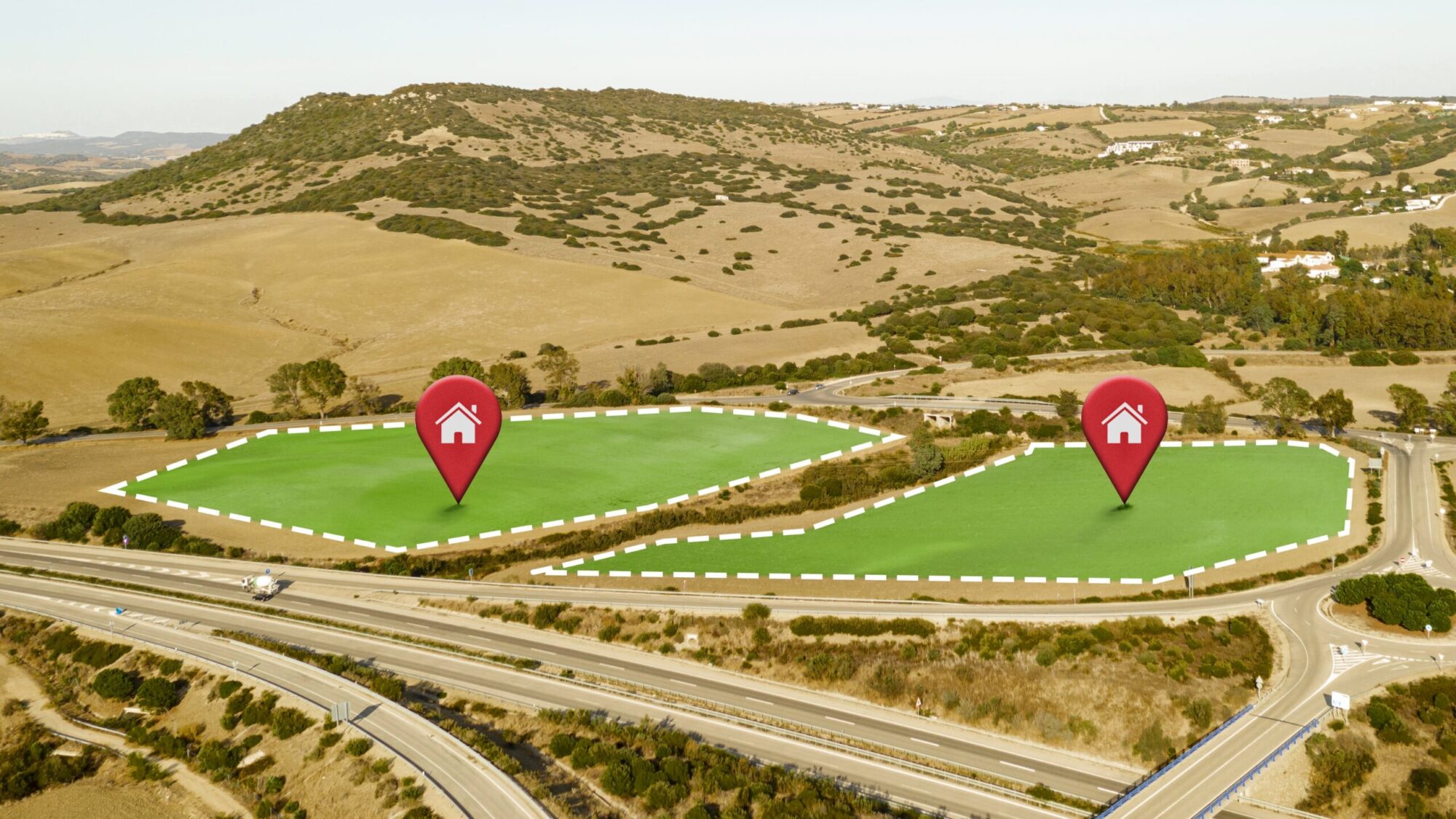 Aerial view of two highlighted plots of land for sale near a highway in the Larnaca property market.